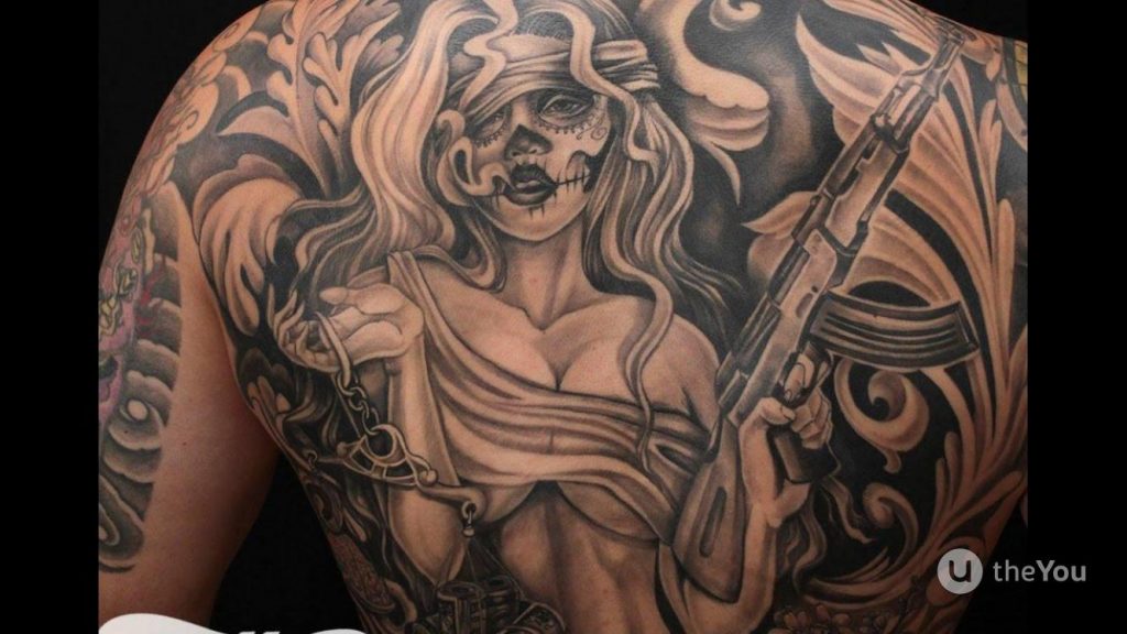 An Angel With A Gun Tattoo Meaning And Designs (angel with gun tattoo)